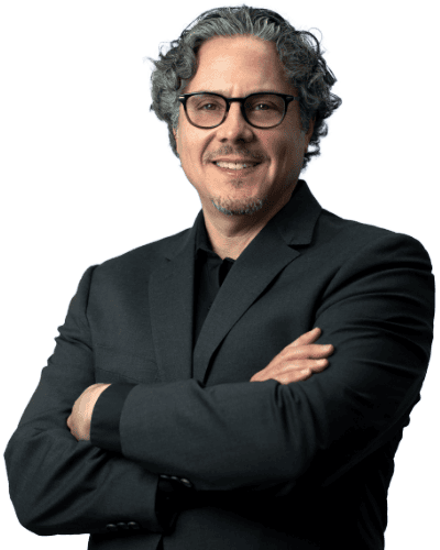 Man in suit smiling arms crossed